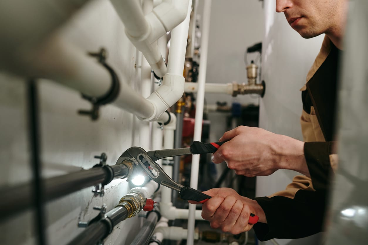 Plumbers maintaining commercial plumbing pipes in North Miami Beach
